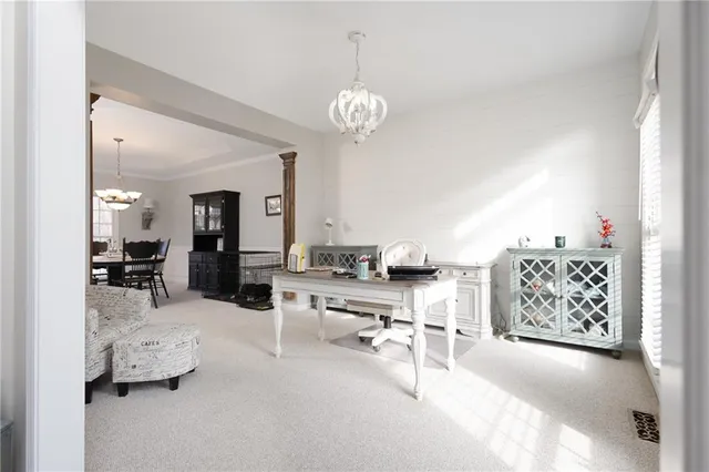 a view of a dining room with furniture and window