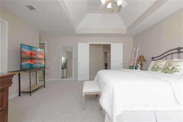 a large bathroom with a large tub shower and sink