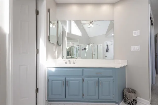 a view of a hallway to a livingroom with windows