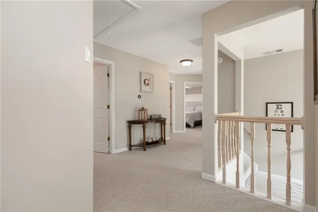 a living room with furniture a ceiling fan and a flat screen tv