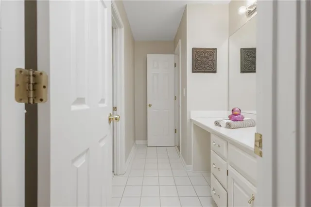 a white refrigerator freezer and a stove sitting inside of a kitchen