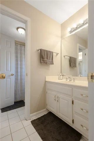 a kitchen with stainless steel appliances kitchen island granite countertop a sink and refrigerator
