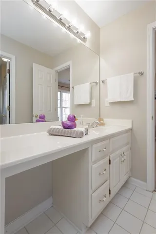 a room with a bed and a chandelier