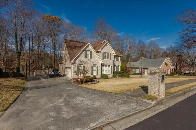 a view of a house with outdoor space and a yard