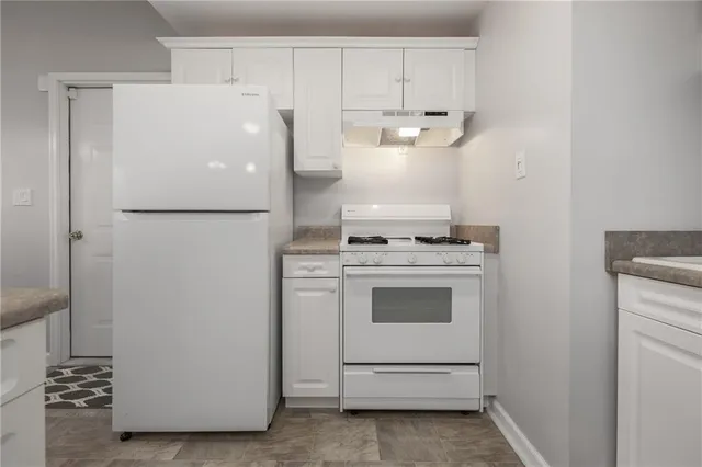 a porch with wooden floor and city view