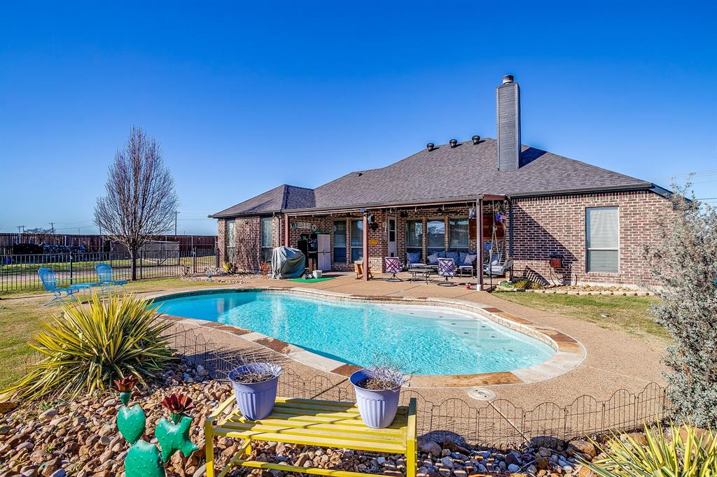 9409 County Road 915 Godley, TX 76044 - Photo 2 of 40 a view of a house with swimming pool and a yard