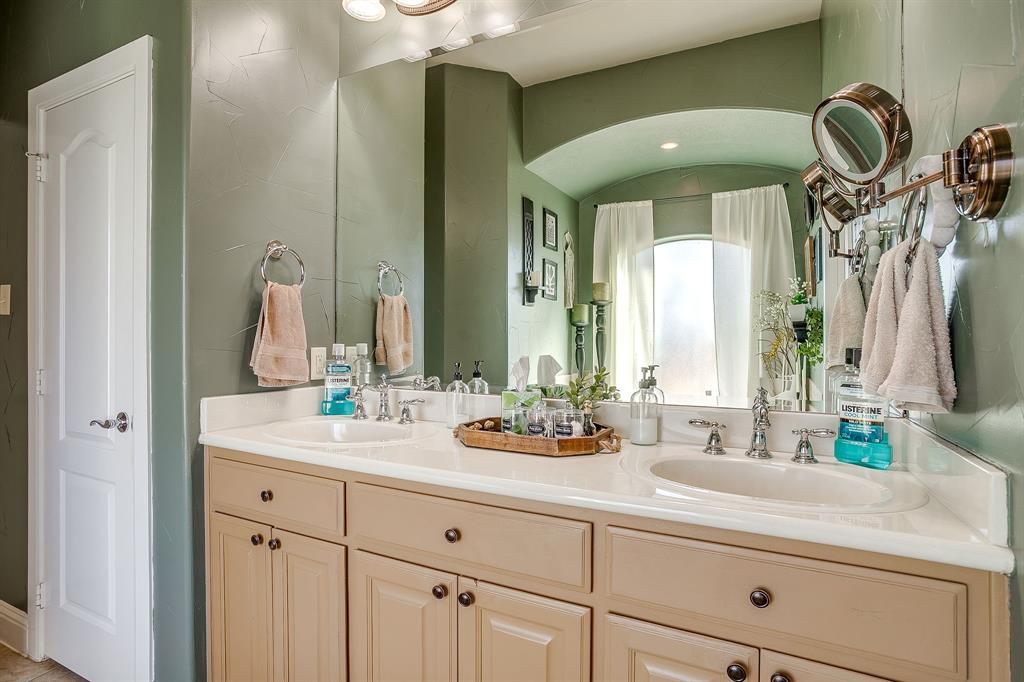9409 County Road 915 Godley, TX 76044 - Photo 21 of 40 a bathroom with sinks mirror and window