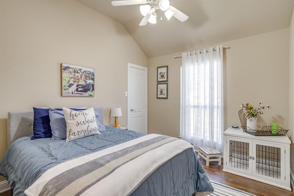 9409 County Road 915 Godley, TX 76044 - Photo 23 of 40 a bedroom with a bed and a window