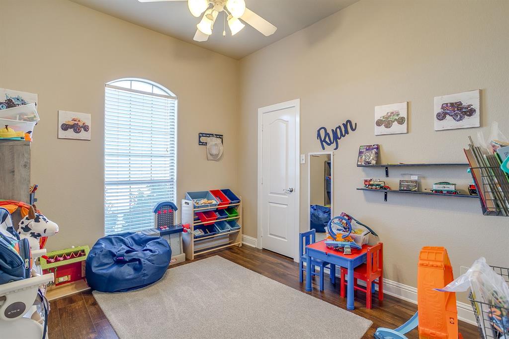 9409 County Road 915 Godley, TX 76044 - Photo 26 of 40 a living room with toys and a couch