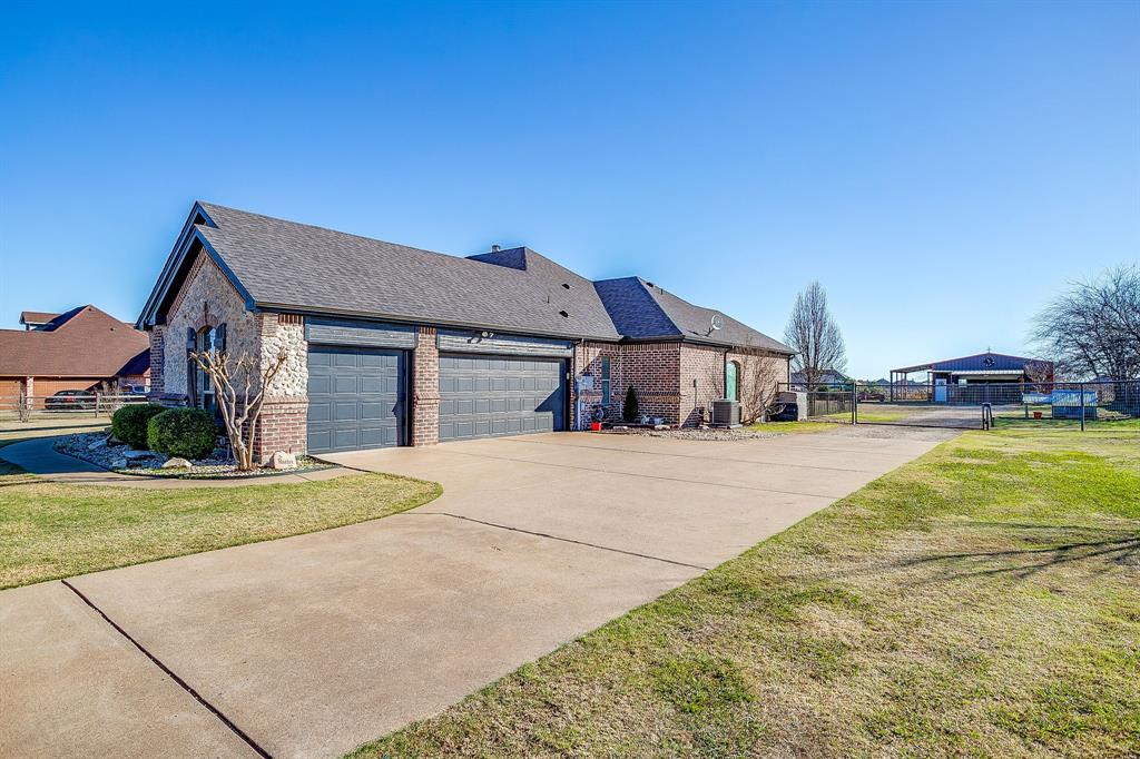 9409 County Road 915 Godley, TX 76044 - Photo 29 of 40 a front view of a house with a yard