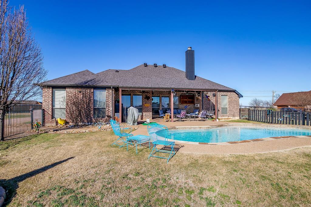 9409 County Road 915 Godley, TX 76044 - Photo 35 of 40 a view of a house with swimming pool and a yard