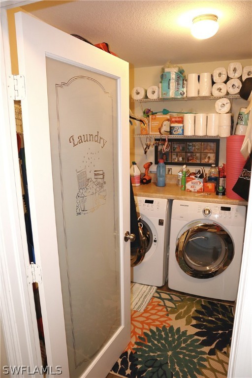 121 Gabriel Circle, Unit 10 Naples, FL 34104 - Photo 17 of 25 a utility room with dryer and washer