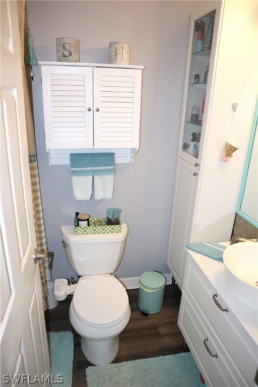 121 Gabriel Circle, Unit 10 Naples, FL 34104 - Photo 21 of 25 a bathroom with a sink and a toilet
