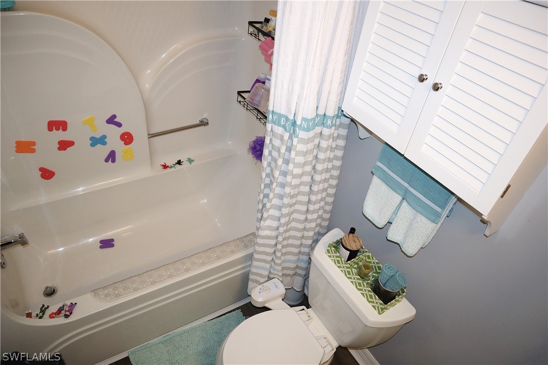 121 Gabriel Circle, Unit 10 Naples, FL 34104 - Photo 22 of 25 a bathroom with a sink toilet and bathtub