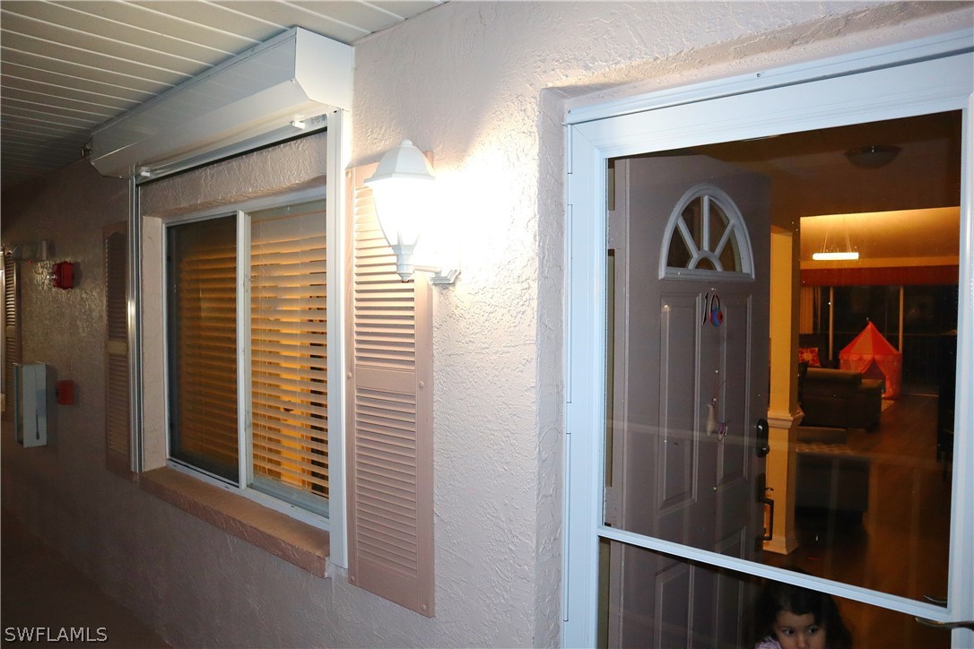 121 Gabriel Circle, Unit 10 Naples, FL 34104 - Photo 24 of 25 a view of a porch of a house