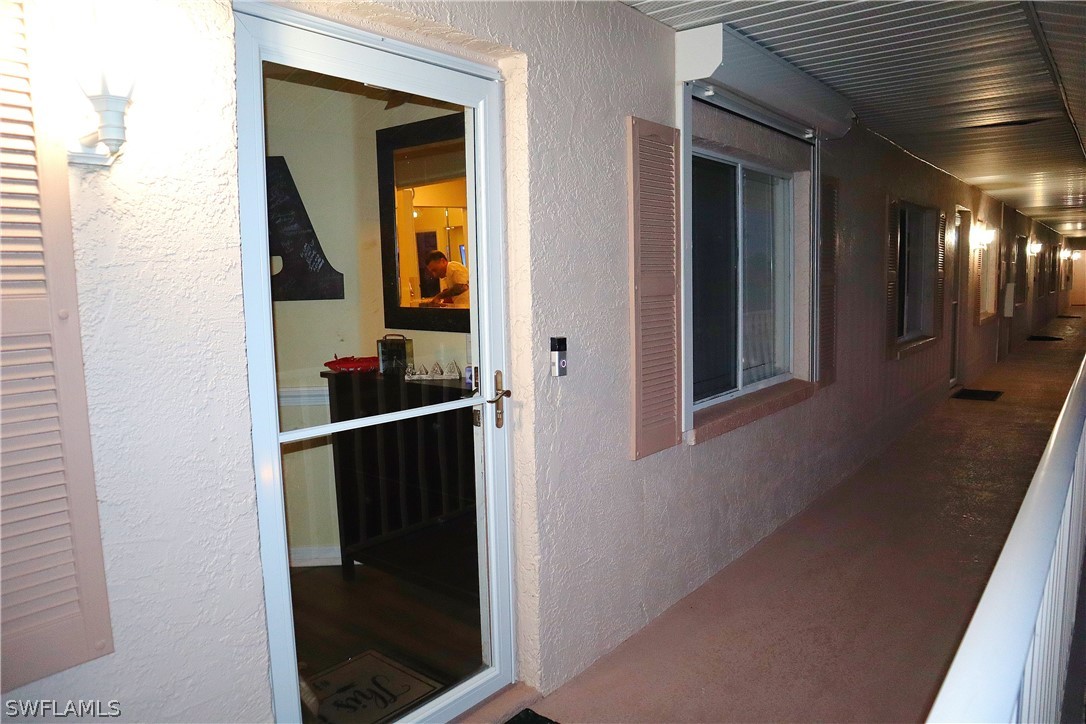 121 Gabriel Circle, Unit 10 Naples, FL 34104 - Photo 25 of 25 a view of a hallway