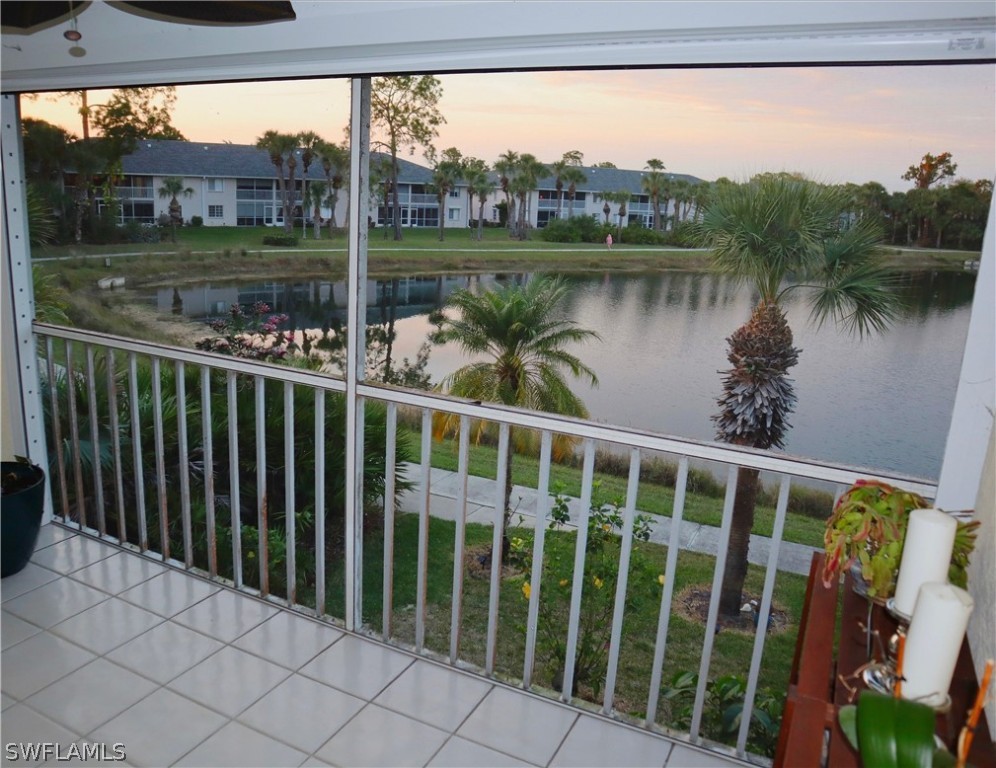 121 Gabriel Circle, Unit 10 Naples, FL 34104 - Photo 5 of 25 a view of a lake from a balcony