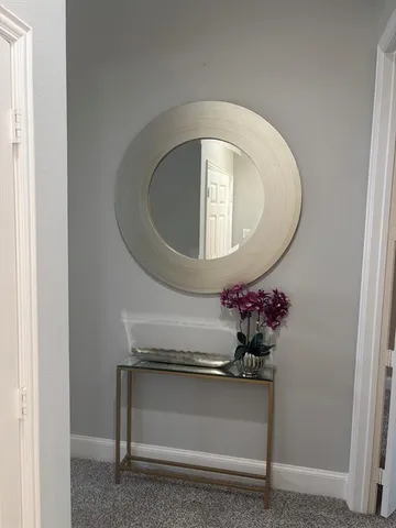 a bedroom with a bed and glass window