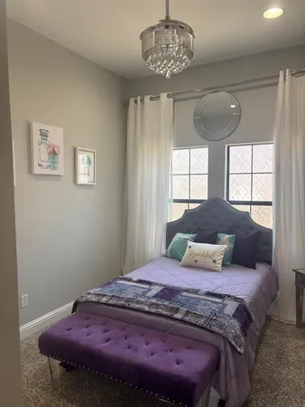 a bedroom with a bed and furniture