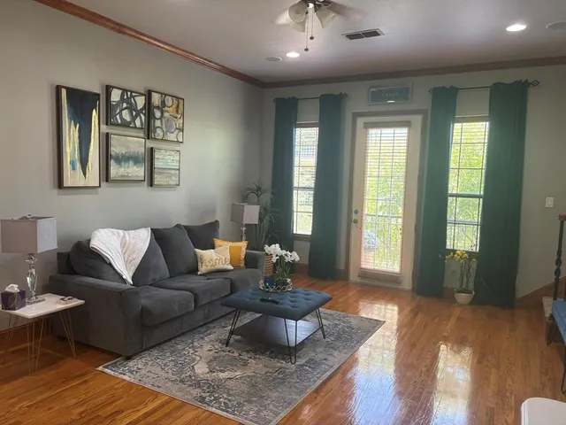 a living room with furniture and a large window