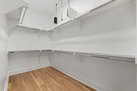 a view of an empty walk in closet