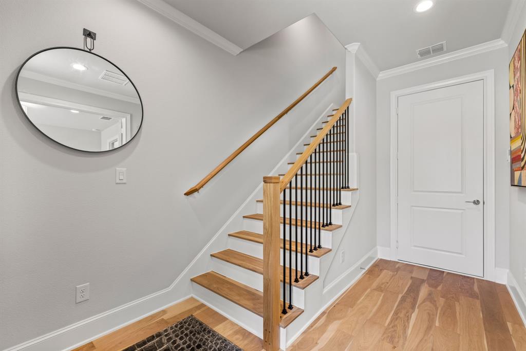 5446 Patterson Court Irving, TX 75039 - Photo 3 of 40 a view of a livingroom with wooden floor and staircase