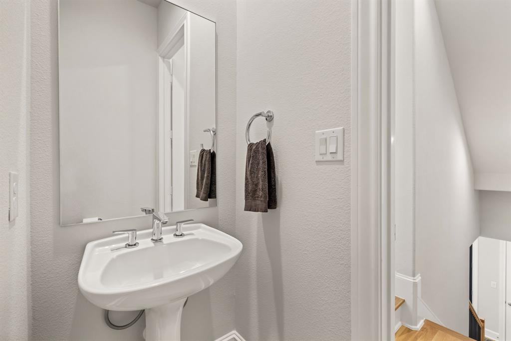5446 Patterson Court Irving, TX 75039 - Photo 32 of 40 a bathroom with a sink and a mirror