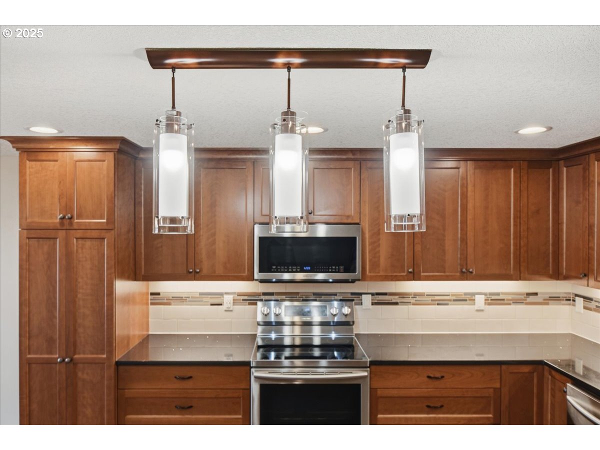 2519 Northwest 13th Street Battle Ground, WA 98604 - Photo 11 of 43 a bathroom with a sink a large mirror and a shower