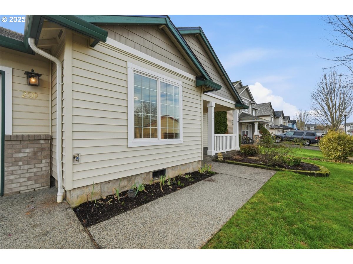 2519 Northwest 13th Street Battle Ground, WA 98604 - Photo 2 of 43 a back view of a house with a yard