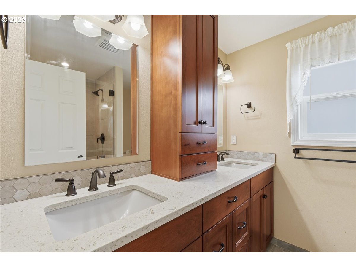 2519 Northwest 13th Street Battle Ground, WA 98604 - Photo 21 of 43 a bathroom with a sink double vanity and a mirror