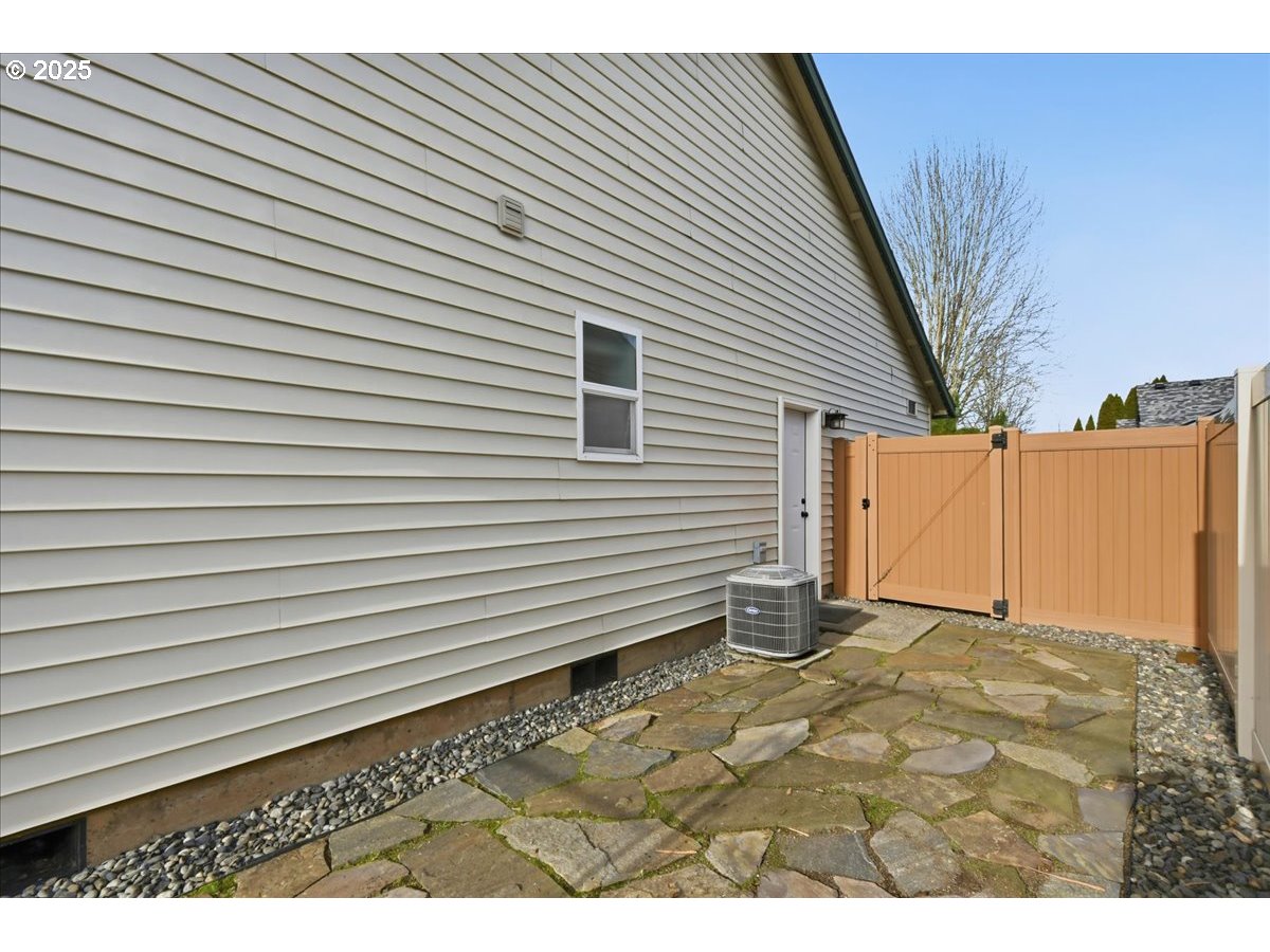 2519 Northwest 13th Street Battle Ground, WA 98604 - Photo 32 of 43 a view of a backyard with a wooden fence