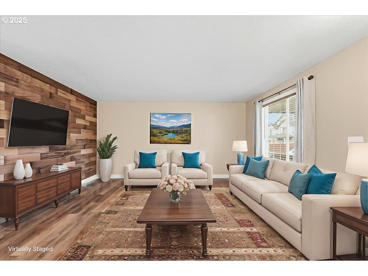 2519 Northwest 13th Street Battle Ground, WA 98604 - Photo 4 of 43 a living room with furniture and a flat screen tv