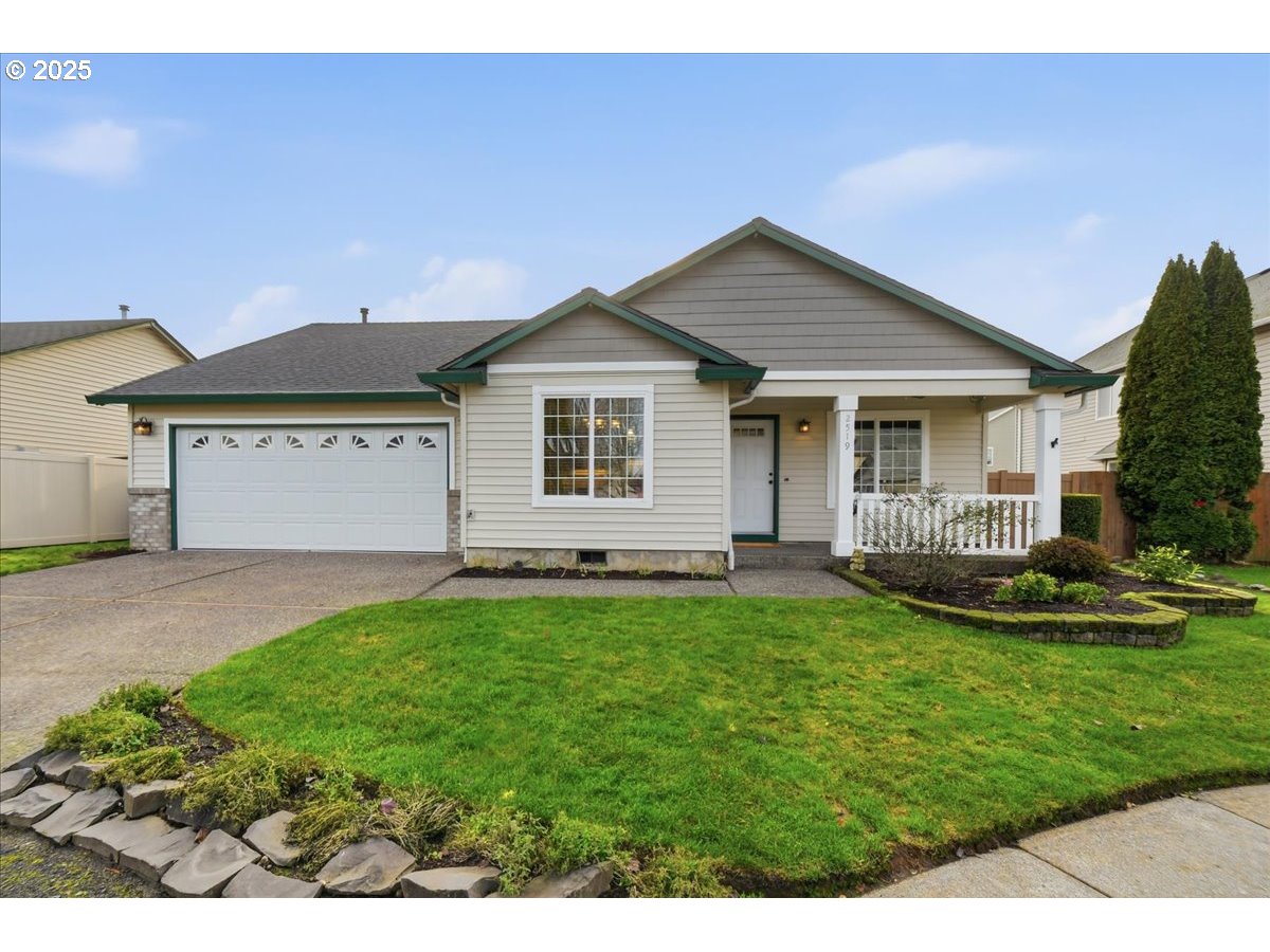 2519 Northwest 13th Street Battle Ground, WA 98604 - Photo 43 of 43 a front view of a house with a garden and yard