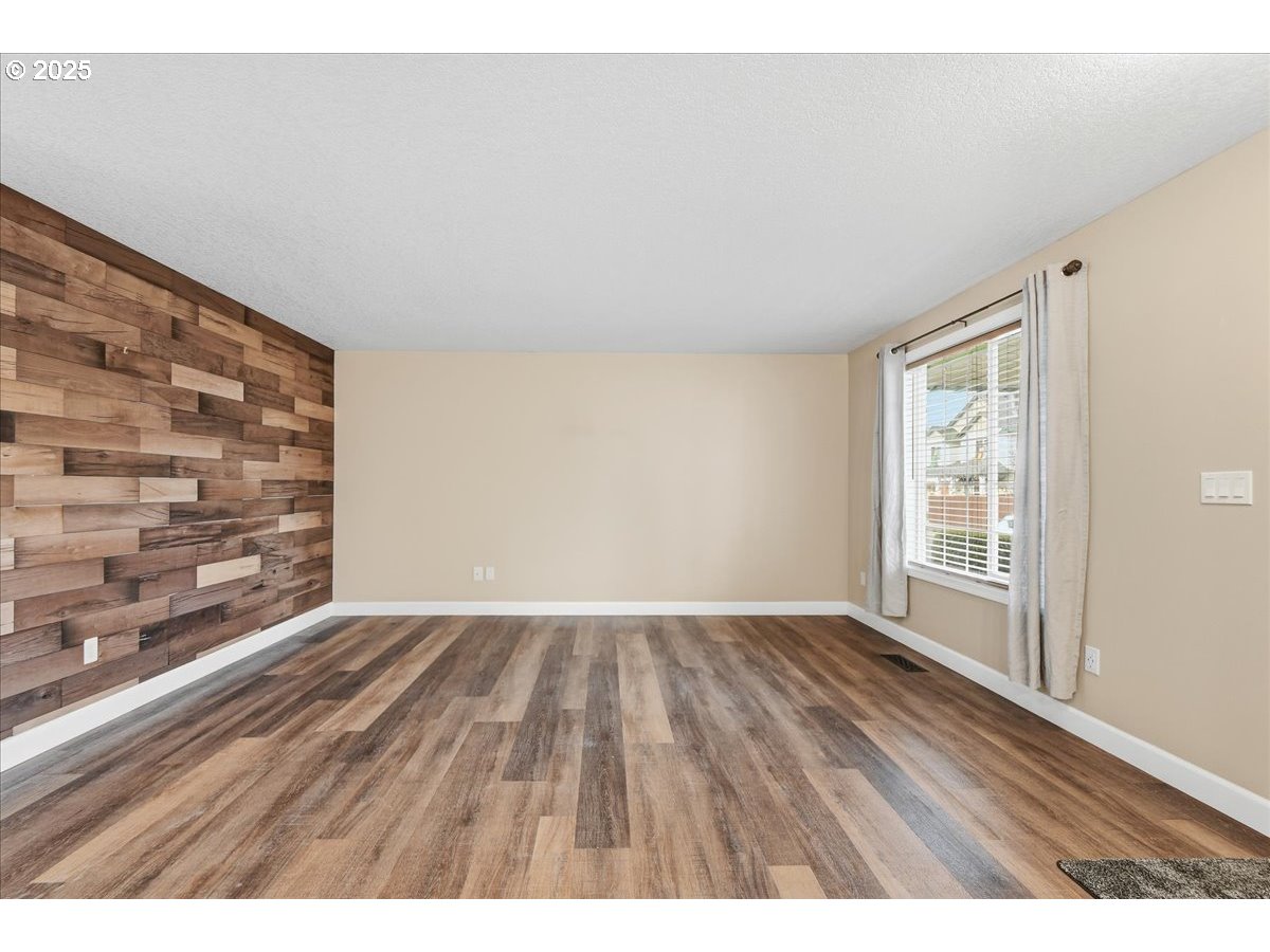 2519 Northwest 13th Street Battle Ground, WA 98604 - Photo 5 of 43 a view of an empty room and wooden floor