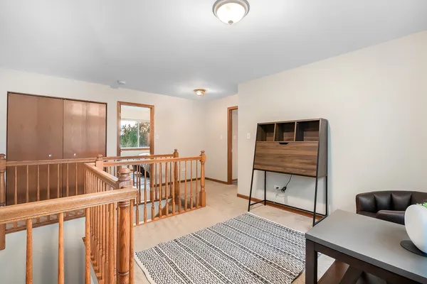 a bedroom with furniture and a wooden floor