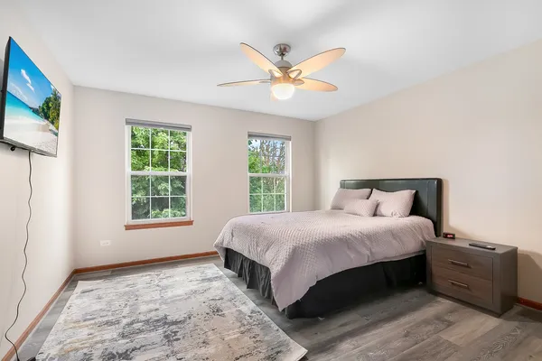 a bedroom with a large bed and a window