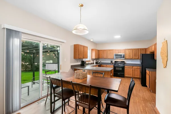 a view of a dining room with furniture window and outside view