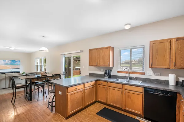 a kitchen with sink cabinets and dining table