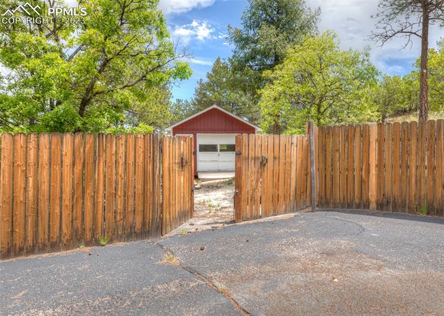 240 Hidden Valley Road Colorado Springs, CO 80919 - Photo 35 of 42 Fencing to shed
