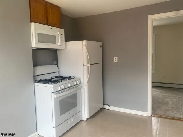 a kitchen with a stove and a microwave