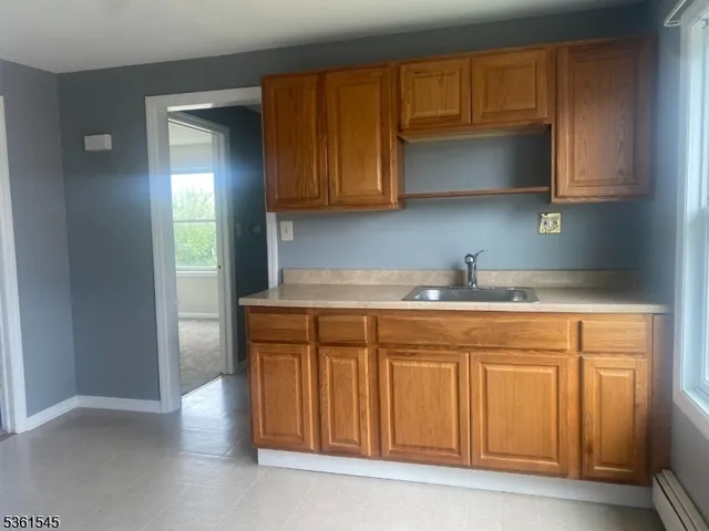 a kitchen with stainless steel appliances granite countertop a sink and a granite counter tops