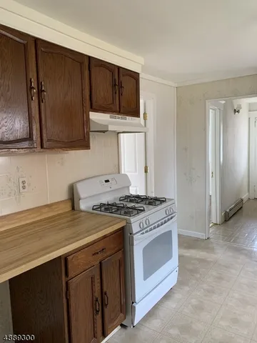 a kitchen with a stove and a sink