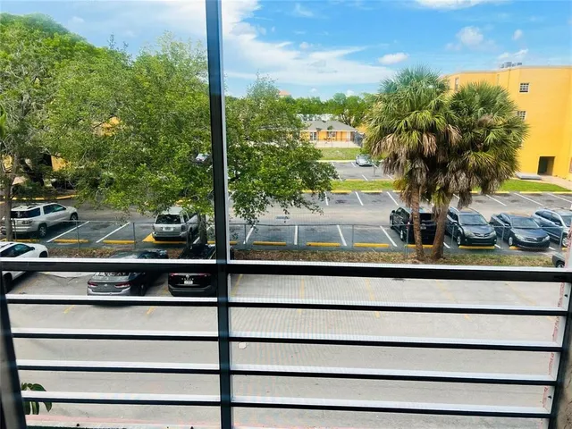 a swimming pool with outdoor seating and yard