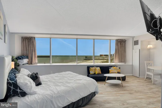 a bed room with a bed and a table