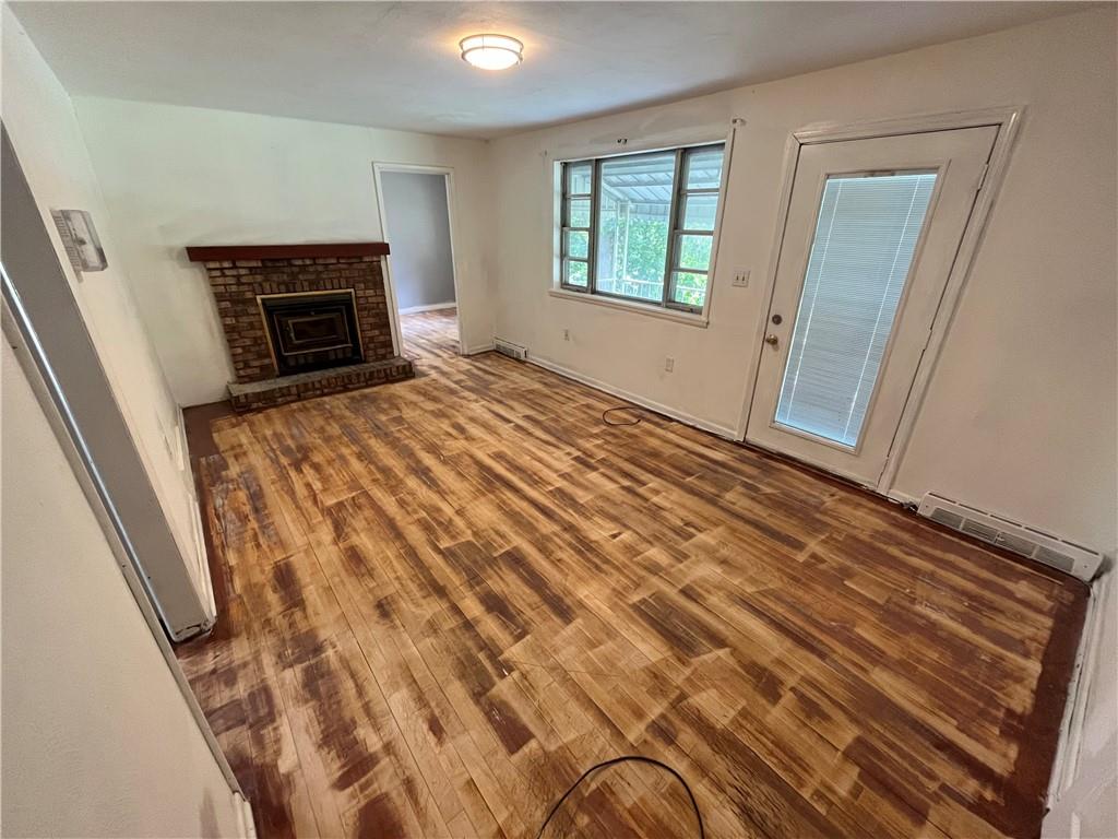 2330 South Bridge Road Washington, PA 15301 - Photo 7 of 13 a view of an empty room with wooden floor and a window