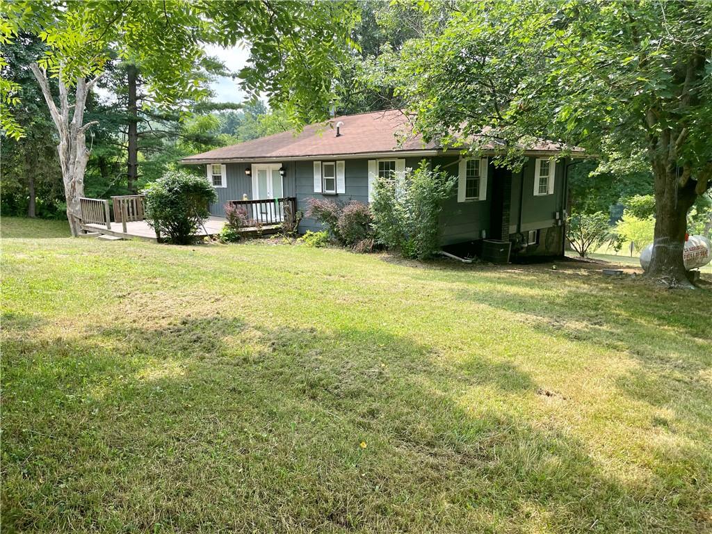 2330 South Bridge Road Washington, PA 15301 - Photo 9 of 13 a front view of a house with a garden