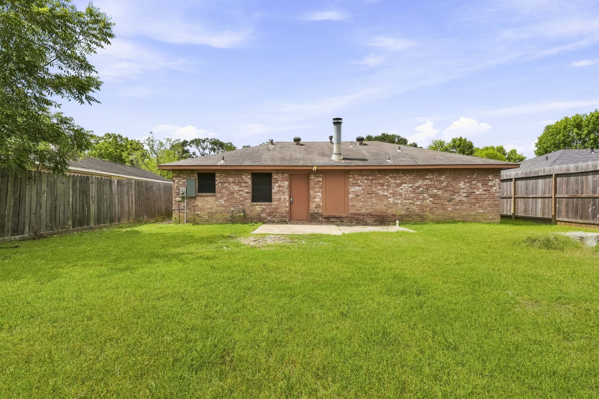 5315 Ridgestone Street Houston, TX 77053 - Photo 17 of 19 Spacious fenced backyard with plenty of room for outdoor enjoyment.
