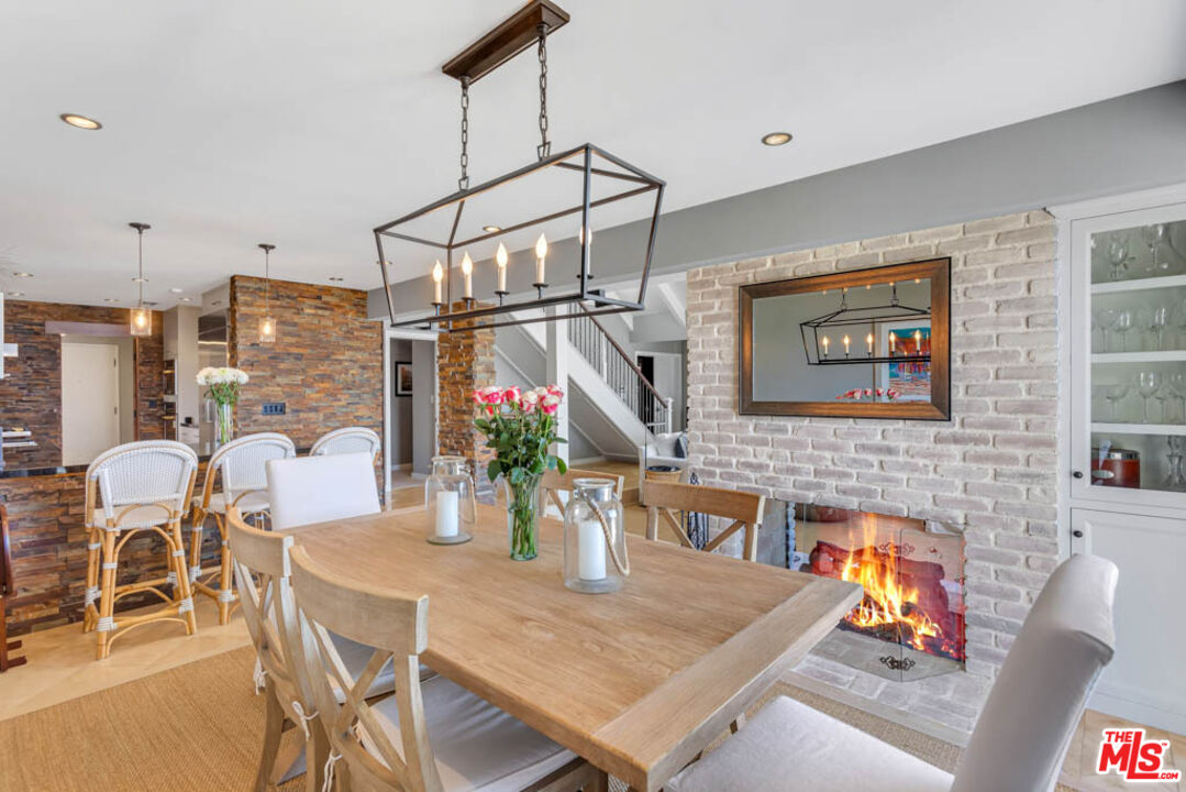 6439 Surfside Way Malibu, CA 90265 - Photo 12 of 32 a view of a dining room with furniture window and wooden floor