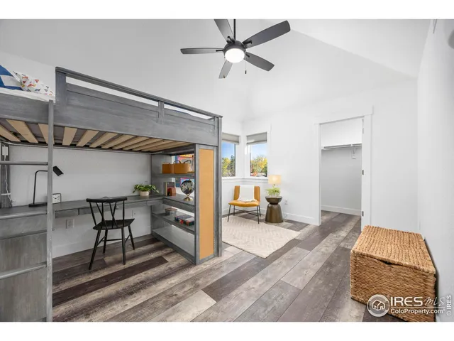 a bedroom with furniture and a chandelier
