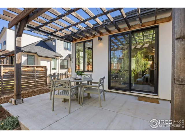 a dining room with furniture water view and wooden floor